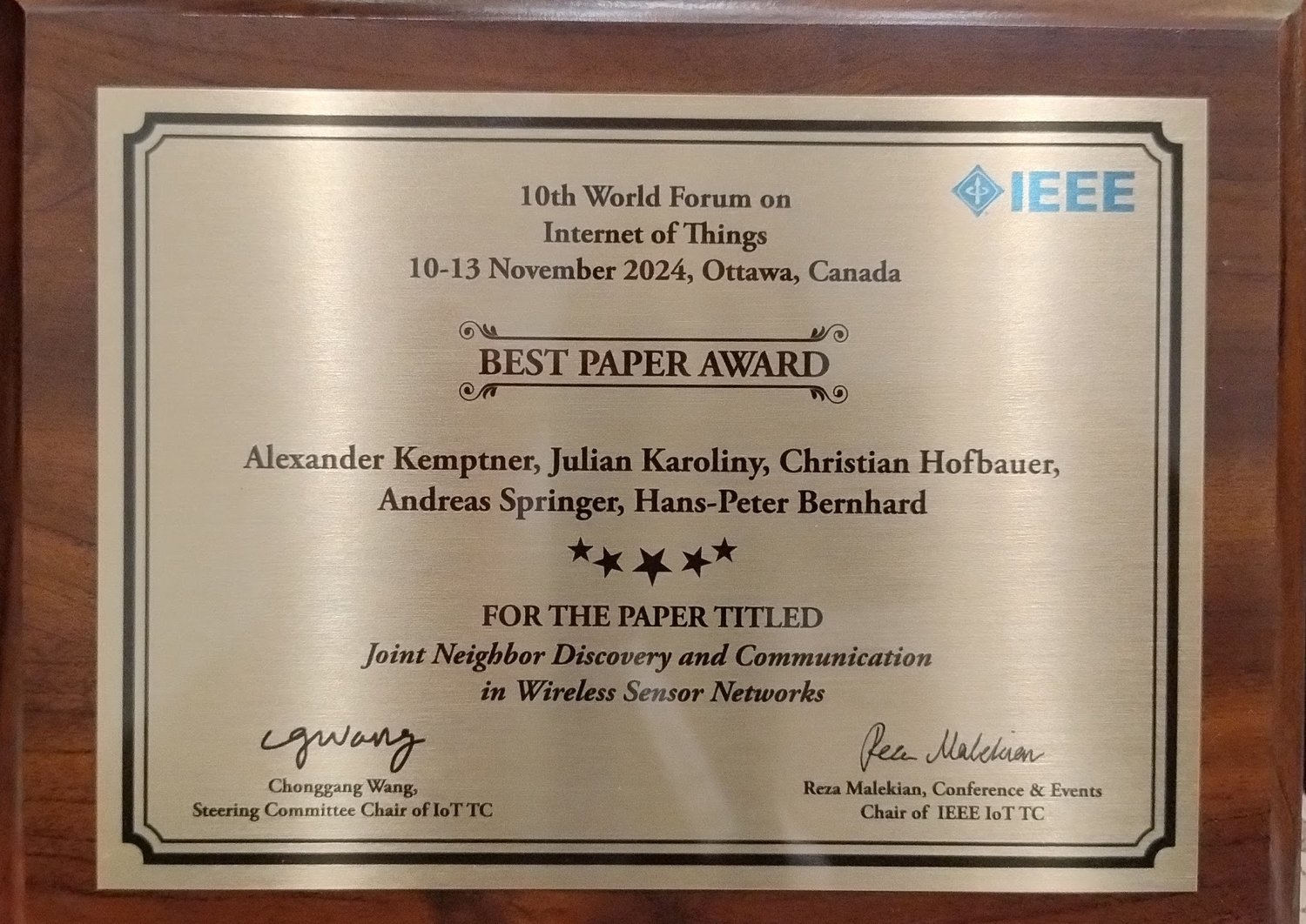 metal plaquette reading "Best paper award" with the name of all the authors and the title of the paper. 