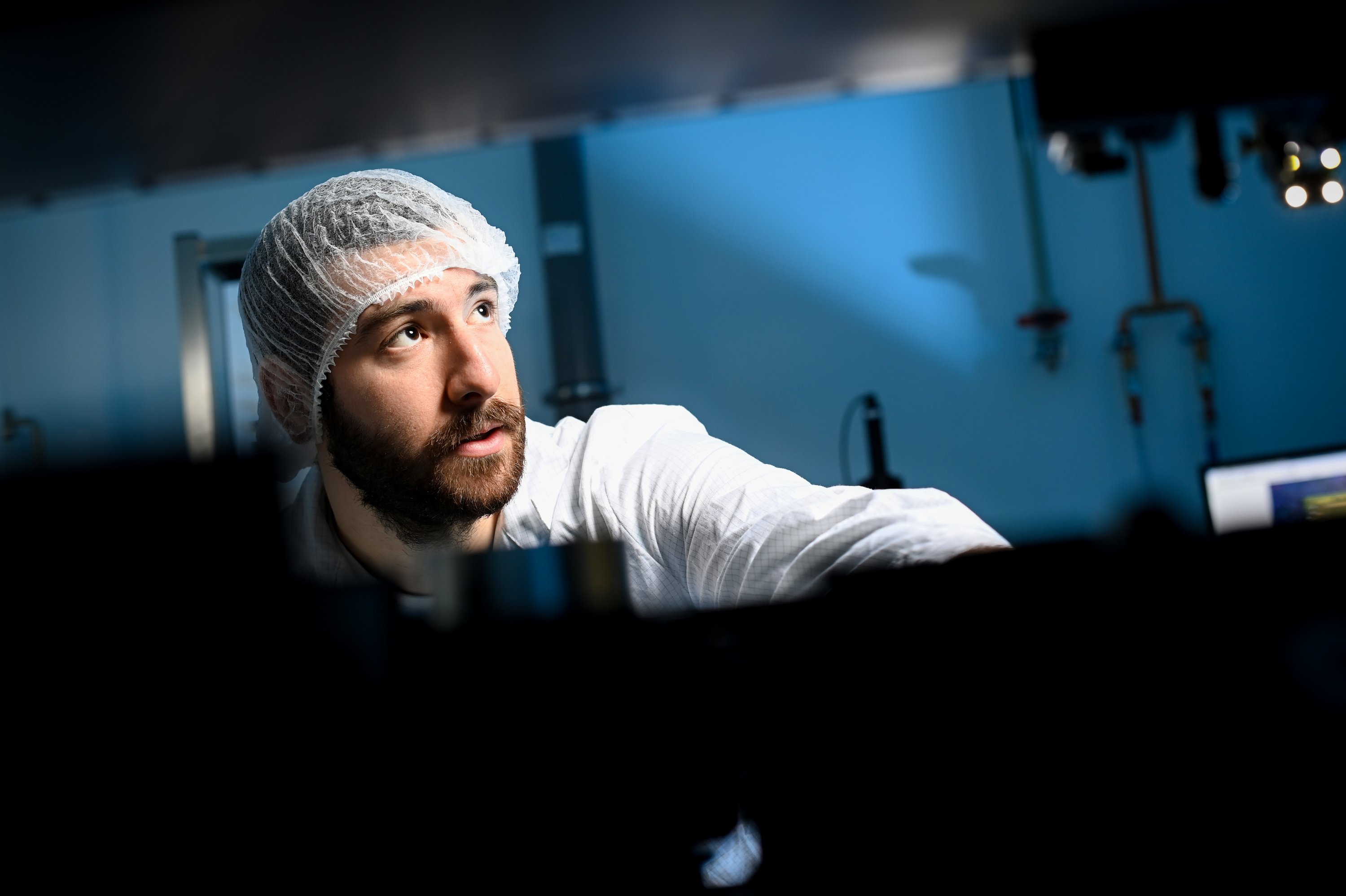 researcher in the cleanroom, wearing protective clothing